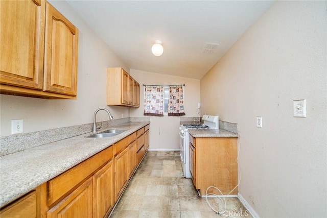 17941 E Payson St, Azusa, CA 91702 - kitchen with white range with gas cooktop, a sink, baseboards, and lofted ceiling