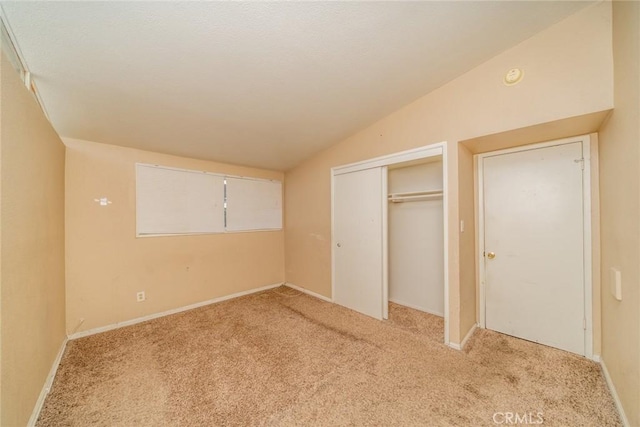 17941 E Payson St, Azusa, CA 91702 - unfurnished bedroom with light carpet, vaulted ceiling, a closet, and baseboards
