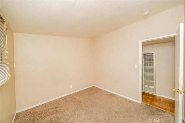 17941 E Payson St, Azusa, CA 91702 - carpeted spare room with a heating unit, baseboards, and a smoke detector