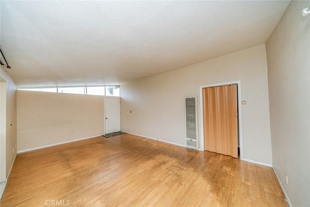 17941 E Payson St, Azusa, CA 91702 - spare room featuring a heating unit, light wood finished floors, and baseboards