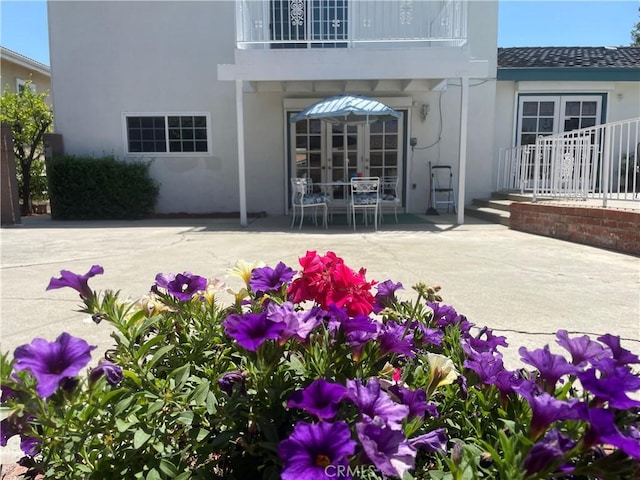 14505 Palm Ave, Hacienda Heights, CA 91745 - doorway to property featuring a patio area, stucco siding, a balcony, and french doors