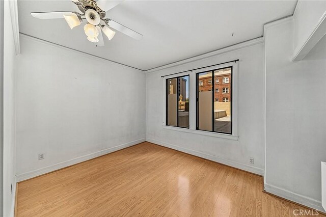 315 W 3rd St Unit 203, Long Beach, CA 90802 - spare room featuring light wood finished floors, baseboards, and a ceiling fan