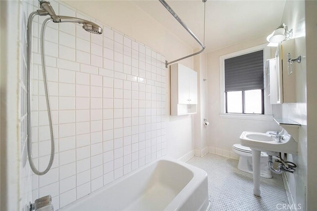 315 W 3rd St Unit 203, Long Beach, CA 90802 - bathroom featuring tub / shower combination, toilet, tile patterned floors, and baseboards