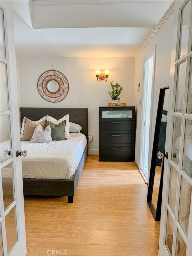 315 W 3rd St Unit 203, Long Beach, CA 90802 - bedroom featuring french doors, wood finished floors, crown molding, and baseboards