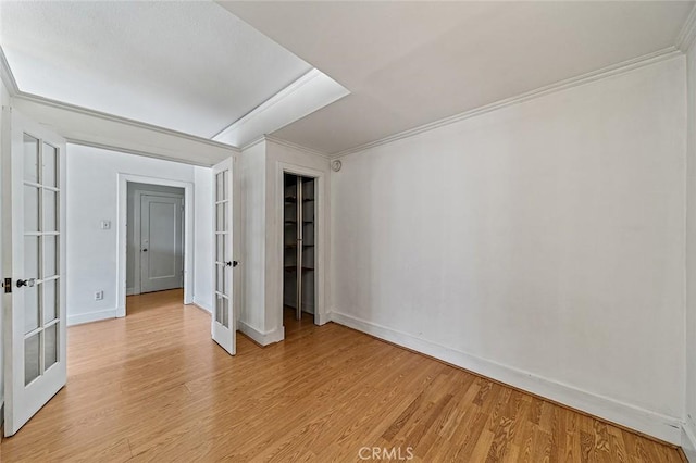 315 W 3rd St Unit 203, Long Beach, CA 90802 - unfurnished bedroom featuring french doors, light wood finished floors, baseboards, and crown molding