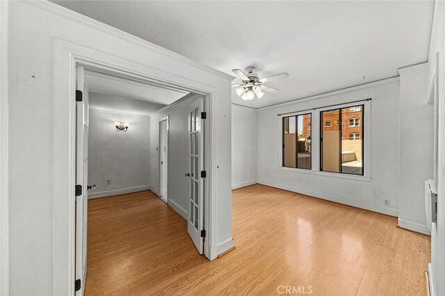 315 W 3rd St Unit 203, Long Beach, CA 90802 - empty room featuring light wood-type flooring, crown molding, baseboards, and ceiling fan