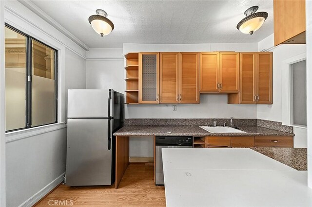 315 W 3rd St Unit 203, Long Beach, CA 90802 - kitchen with stainless steel appliances, a sink, light wood finished floors, open shelves, and dark countertops