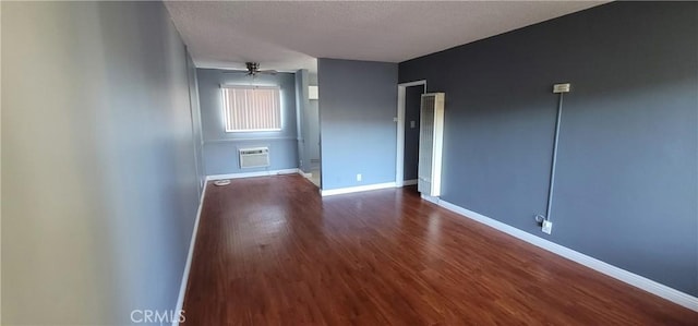 7107 Coldwater Canyon Ave, North Hollywood, CA 91605 - unfurnished bedroom with baseboards, wood finished floors, an AC wall unit, and a textured ceiling
