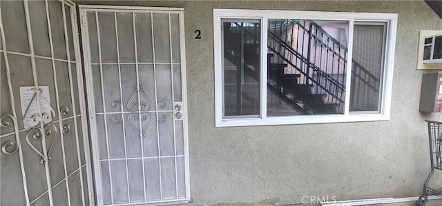 7107 Coldwater Canyon Ave, North Hollywood, CA 91605 - doorway to property with stucco siding