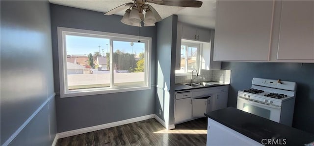 7107 Coldwater Canyon Ave, North Hollywood, CA 91605 - kitchen featuring white appliances, dark countertops, dark wood finished floors, a sink, and a ceiling fan