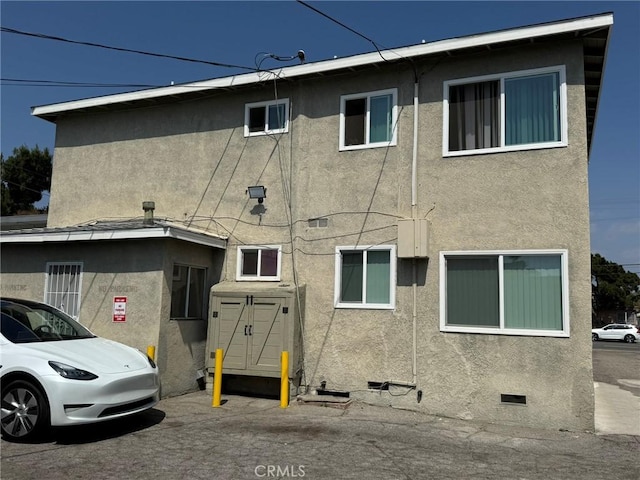 7107 Coldwater Canyon Ave, North Hollywood, CA 91605 - rear view of property featuring stucco siding and crawl space