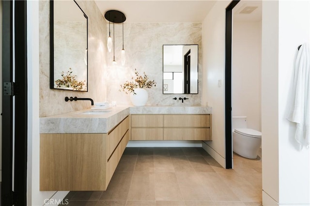 2321 Mesa Dr, Newport Beach, CA 92660 - bathroom with tile patterned floors, double vanity, toilet, and decorative backsplash
