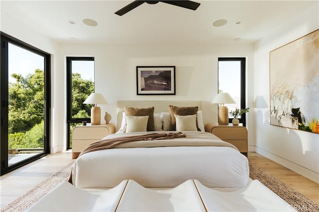2321 Mesa Dr, Newport Beach, CA 92660 - bedroom with light wood-style floors, multiple windows, access to outside, and a ceiling fan