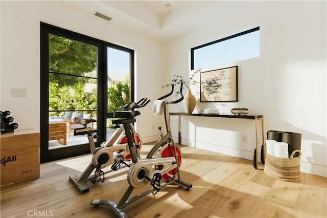 2321 Mesa Dr, Newport Beach, CA 92660 - exercise room with healthy amount of natural light and wood finished floors