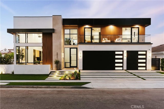 2321 Mesa Dr, Newport Beach, CA 92660 - modern home featuring a balcony, concrete driveway, and a garage