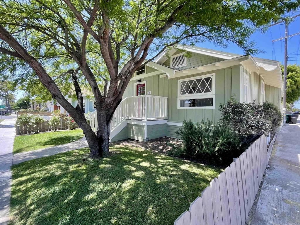 1520 Madison Ave, San Diego, CA 92116 - view of front of property with board and batten siding and a front lawn