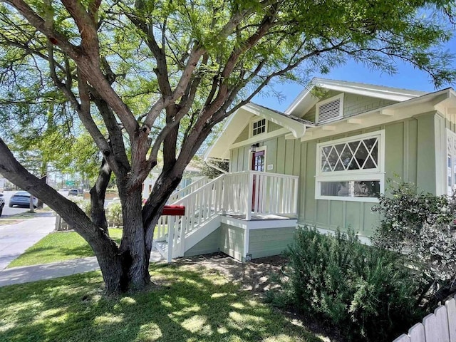 1520 Madison Ave, San Diego, CA 92116 - view of home's exterior featuring board and batten siding and a lawn