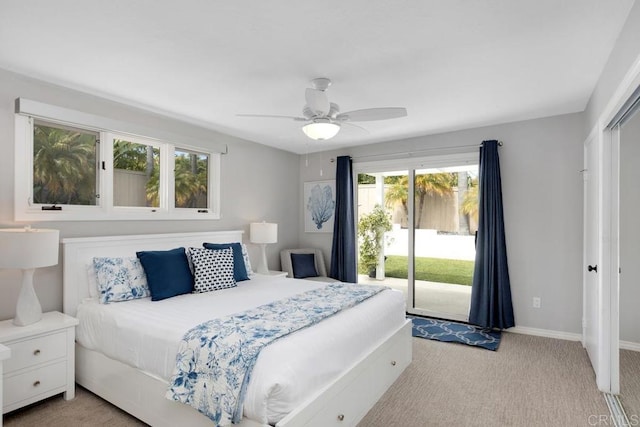 5918 Germaine Ln, La Jolla, CA 92037 - bedroom featuring multiple windows, access to outside, light carpet, and baseboards