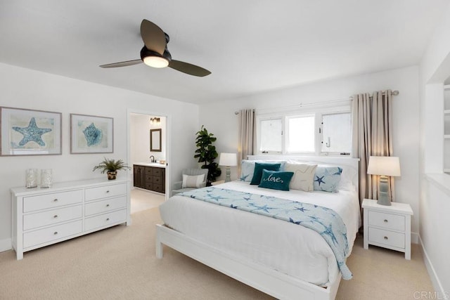 5918 Germaine Ln, La Jolla, CA 92037 - bedroom with light colored carpet, ensuite bathroom, ceiling fan, and baseboards