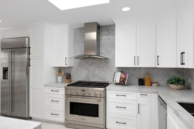 5918 Germaine Ln, La Jolla, CA 92037 - kitchen with premium appliances, wall chimney range hood, white cabinets, backsplash, and recessed lighting
