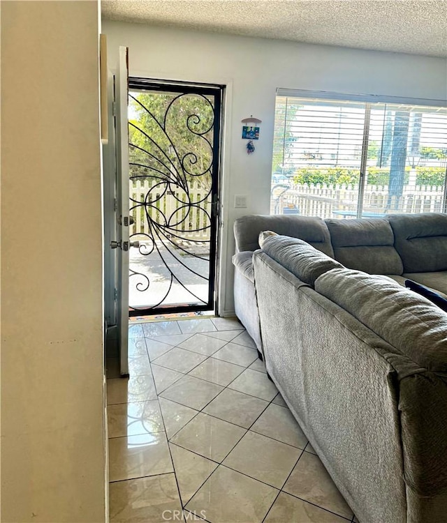 13321 Meyer Rd Unit B, Whittier, CA 90605 - foyer entrance featuring plenty of natural light, a textured ceiling, and light tile patterned flooring