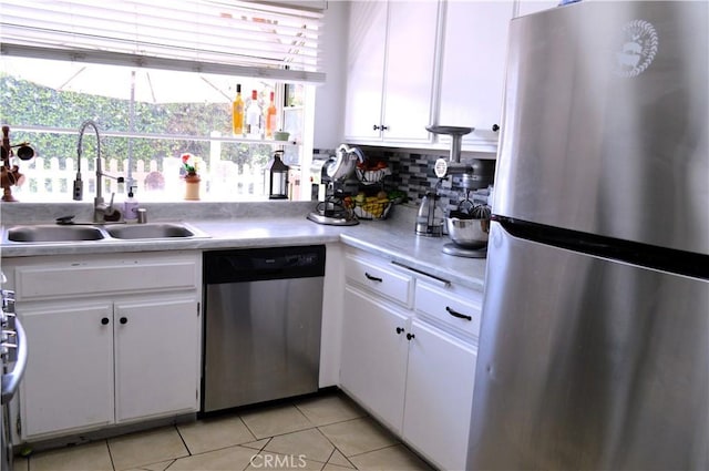 13321 Meyer Rd Unit B, Whittier, CA 90605 - kitchen featuring stainless steel appliances, a sink, white cabinetry, light tile patterned floors, and light countertops