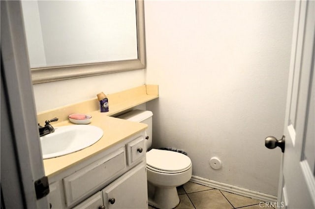 13321 Meyer Rd Unit B, Whittier, CA 90605 - half bathroom with vanity, tile patterned floors, toilet, and baseboards