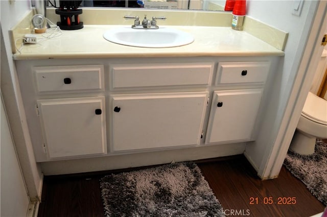 13321 Meyer Rd Unit B, Whittier, CA 90605 - bathroom featuring toilet, vanity, and wood finished floors