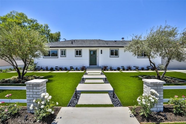 13181 Olympia Way N, Tustin, CA 92705 - ranch-style house with a tile roof, a front yard, and stucco siding