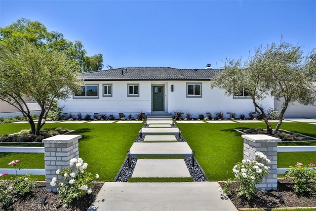 13181 Olympia Way N, Tustin, CA 92705 - ranch-style house with a tiled roof, a front lawn, and stucco siding