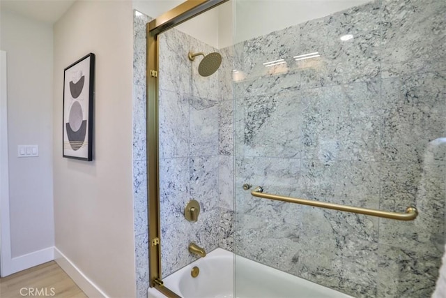 13181 Olympia Way N, Tustin, CA 92705 - bathroom featuring shower / bath combination with glass door, wood finished floors, and baseboards