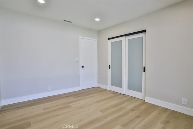 13181 Olympia Way N, Tustin, CA 92705 - unfurnished bedroom with recessed lighting, light wood finished floors, baseboards, and a closet