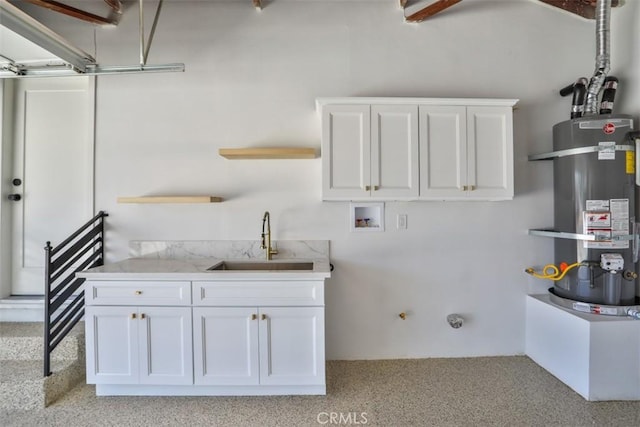 13181 Olympia Way N, Tustin, CA 92705 - washroom featuring strapped water heater, washer hookup, cabinet space, and light carpet