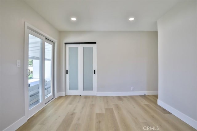 13181 Olympia Way N, Tustin, CA 92705 - spare room featuring light wood-style floors, baseboards, and recessed lighting