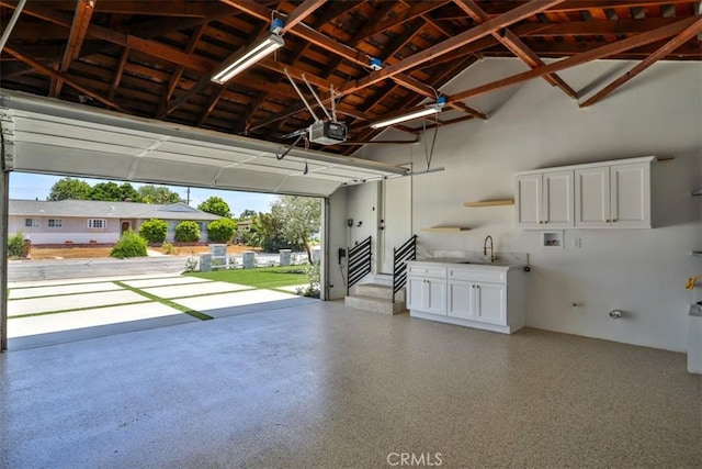 13181 Olympia Way N, Tustin, CA 92705 - garage with a garage door opener and a sink