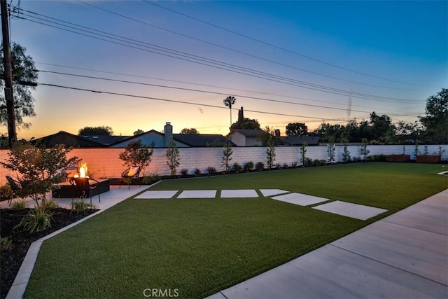 13181 Olympia Way N, Tustin, CA 92705 - yard at dusk featuring a patio area