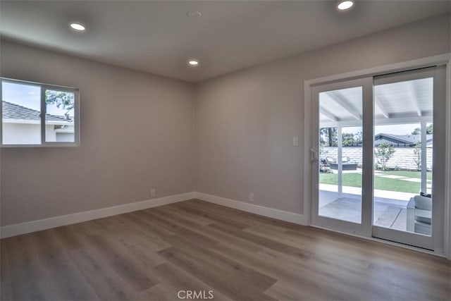 13181 Olympia Way N, Tustin, CA 92705 - spare room featuring baseboards, wood finished floors, and recessed lighting