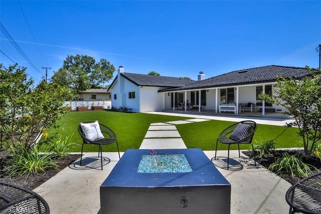 13181 Olympia Way N, Tustin, CA 92705 - back of property with a fire pit, a patio area, and stucco siding
