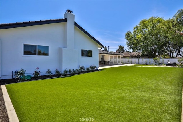 13181 Olympia Way N, Tustin, CA 92705 - rear view of house with a chimney, a patio, and stucco siding