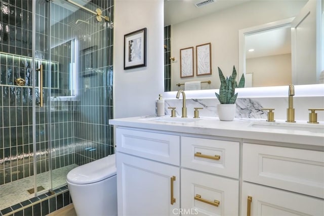 13181 Olympia Way N, Tustin, CA 92705 - full bathroom with double vanity, a stall shower, and toilet