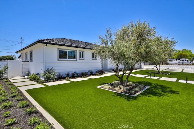 13181 Olympia Way N, Tustin, CA 92705 - rear view of house featuring a lawn, a tile roof, and a gate