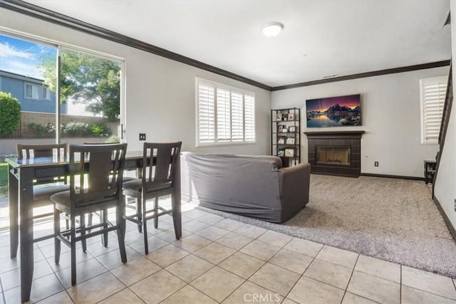 5794 Bay Hill Ln, Fontana, CA 92336 - living room featuring crown molding, plenty of natural light, light tile patterned flooring, a fireplace, and light carpet