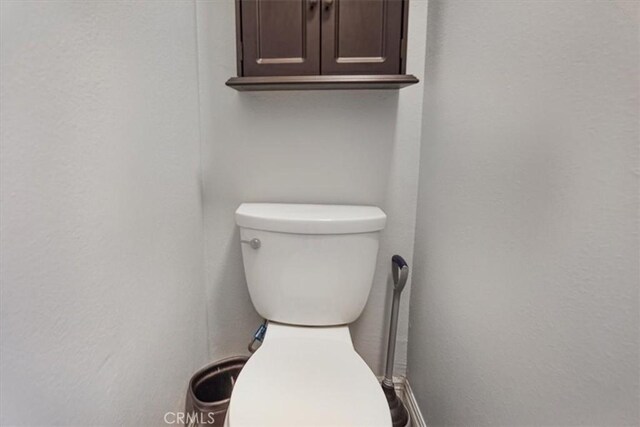 5794 Bay Hill Ln, Fontana, CA 92336 - bathroom featuring toilet and a textured wall