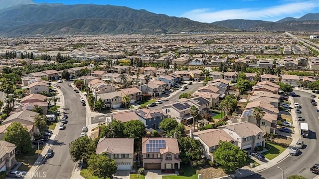 5794 Bay Hill Ln, Fontana, CA 92336 - aerial view of property and surrounding area featuring nearby suburban area and mountains