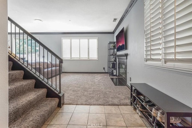 5794 Bay Hill Ln, Fontana, CA 92336 - tiled living room with carpet floors, crown molding, stairway, and plenty of natural light