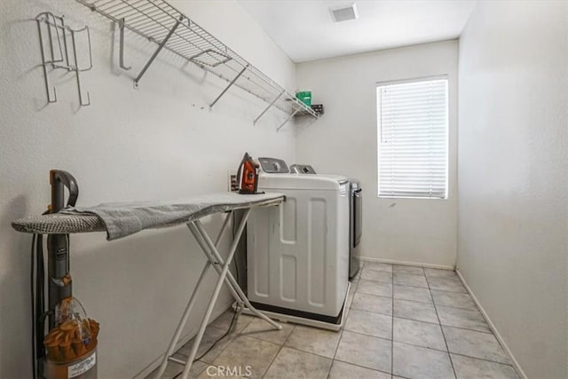 5794 Bay Hill Ln, Fontana, CA 92336 - washroom featuring separate washer and dryer and light tile patterned flooring