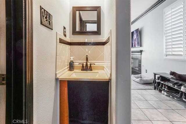 5794 Bay Hill Ln, Fontana, CA 92336 - bar area featuring a textured wall, light tile patterned flooring, and a fireplace