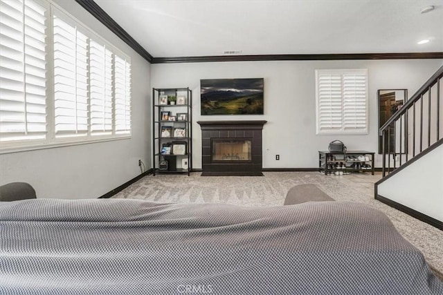 5794 Bay Hill Ln, Fontana, CA 92336 - carpeted living area featuring ornamental molding, a tiled fireplace, and stairs