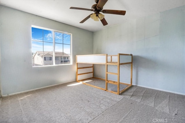 5794 Bay Hill Ln, Fontana, CA 92336 - unfurnished bedroom with carpet flooring and ceiling fan