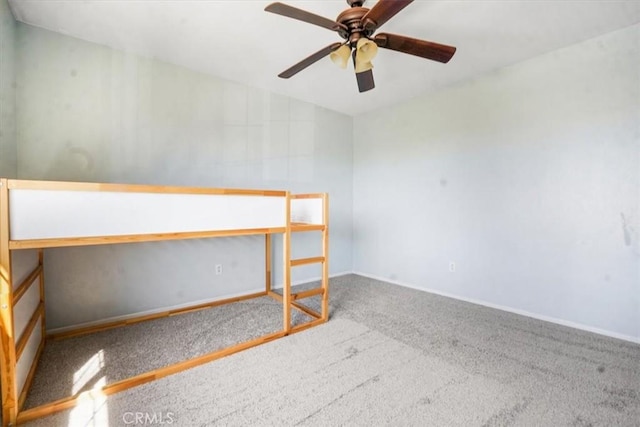 5794 Bay Hill Ln, Fontana, CA 92336 - carpeted spare room with baseboards and a ceiling fan